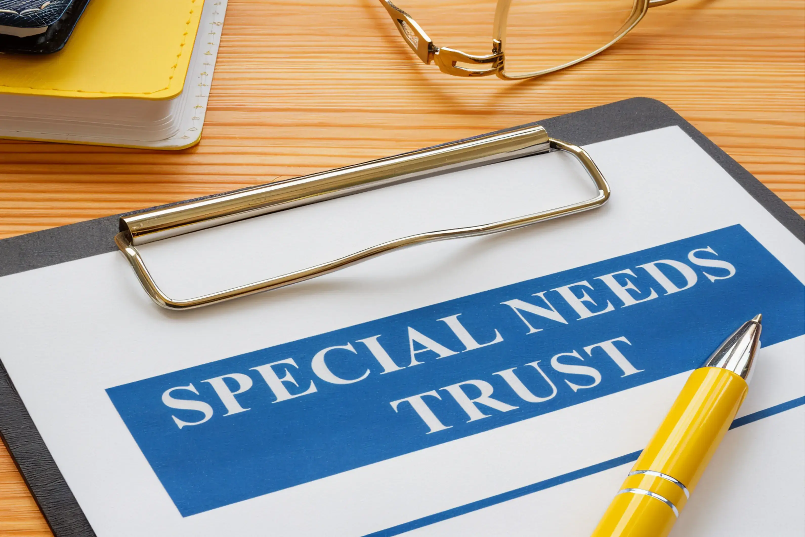 Special needs trust document with pen.