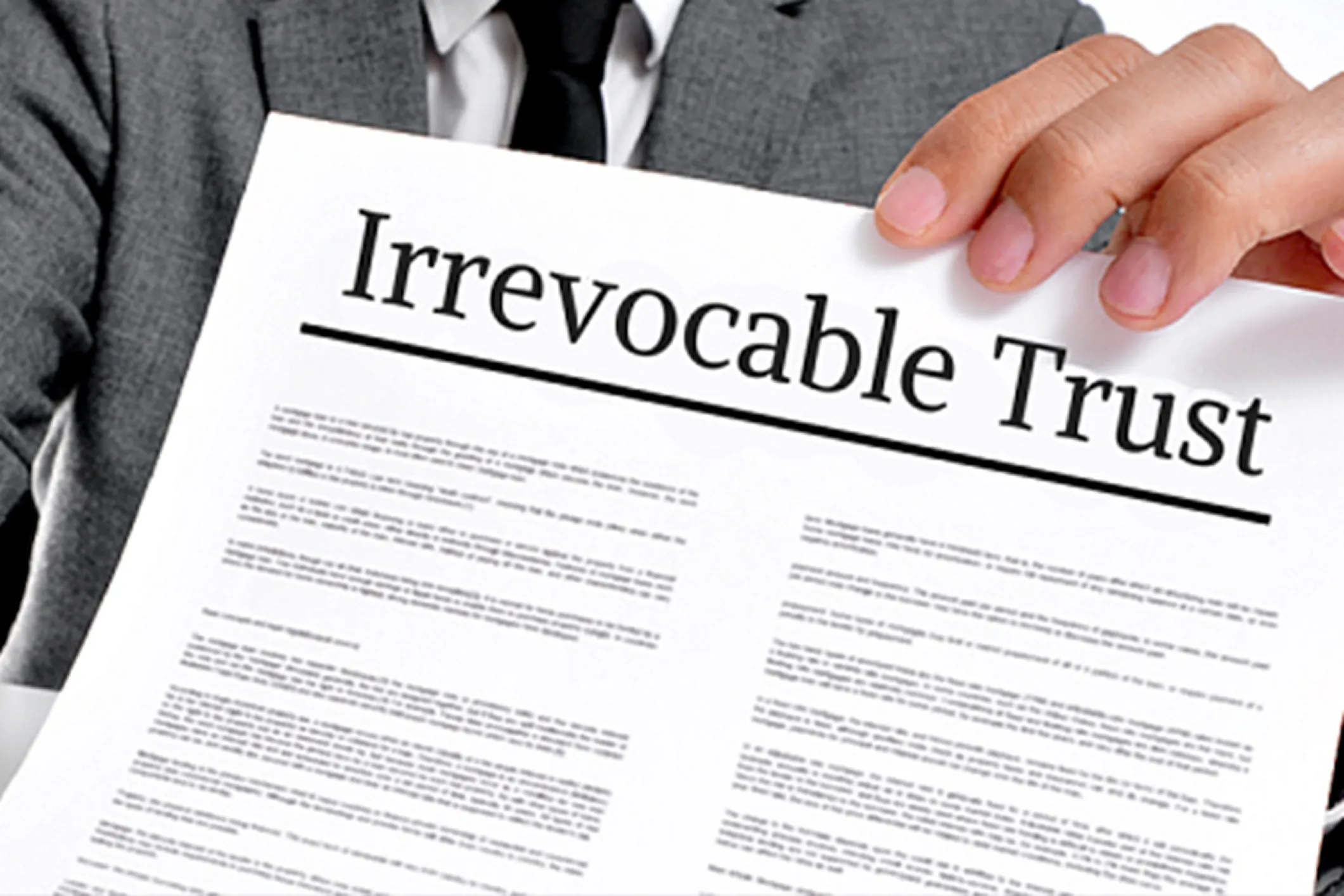 Man holding irrevocable trust document.