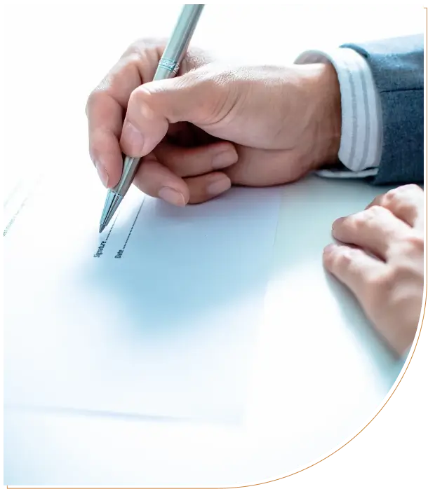 Hand holding a compass drawing on a blank sheet of paper.