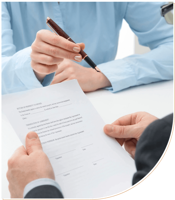 Two people reviewing a contract document together.